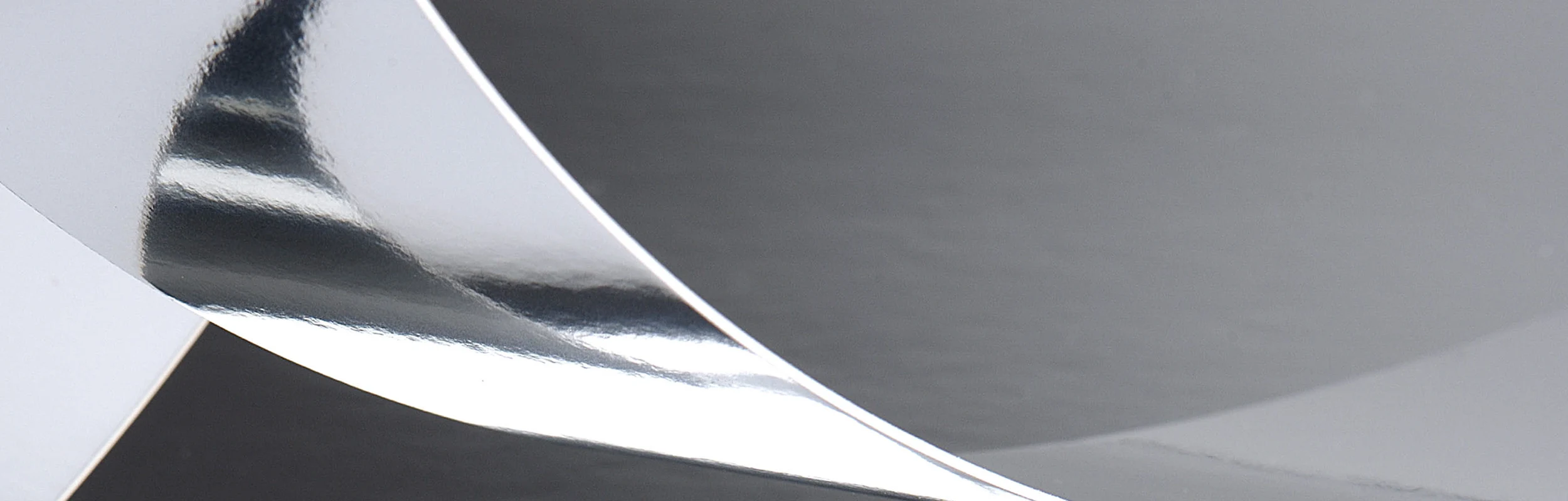 Metal foil for laminating paperboard