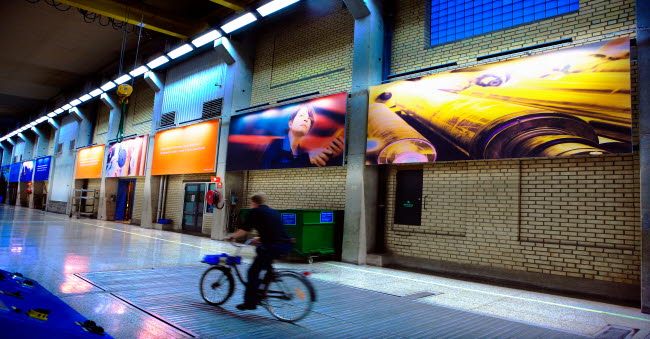 Man on bicycle inside an Iggesund mill facility