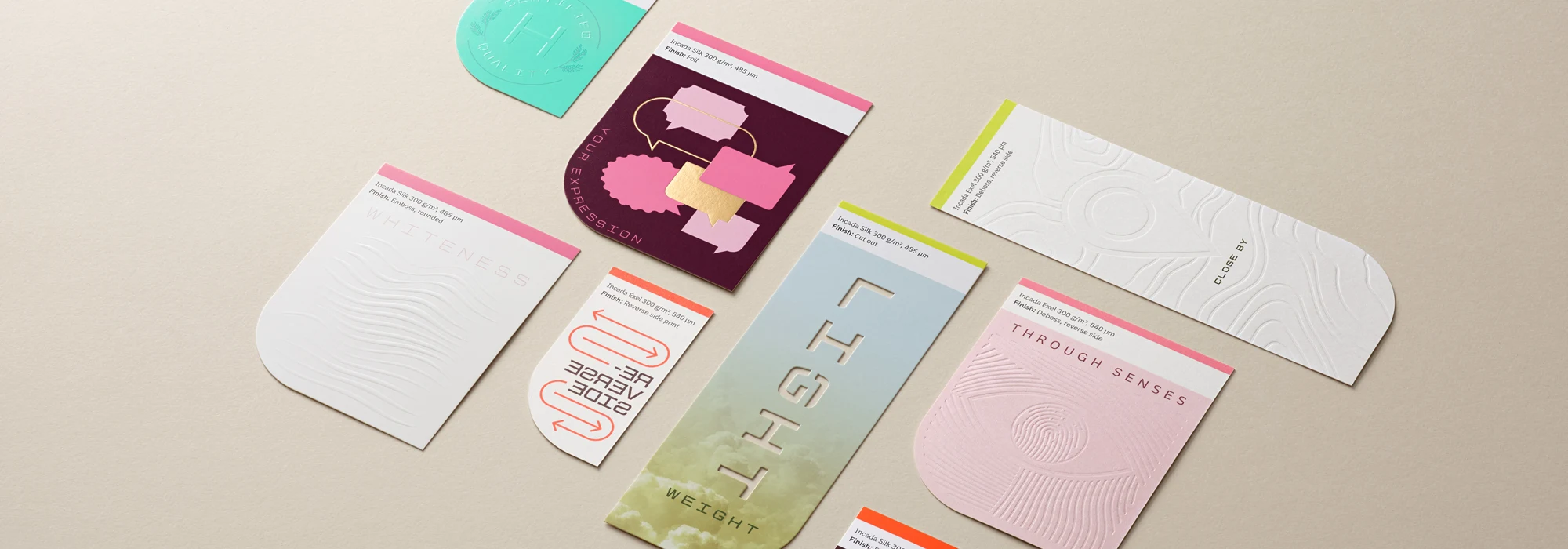 Paperboard cards with various printing effects placed on beige background