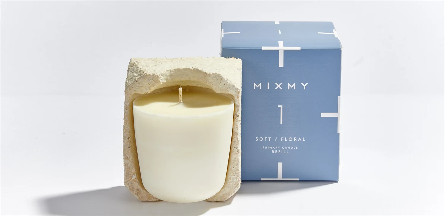 Scented candle from MIXMY Scents with blue paperboard packaging made on Incada Silk