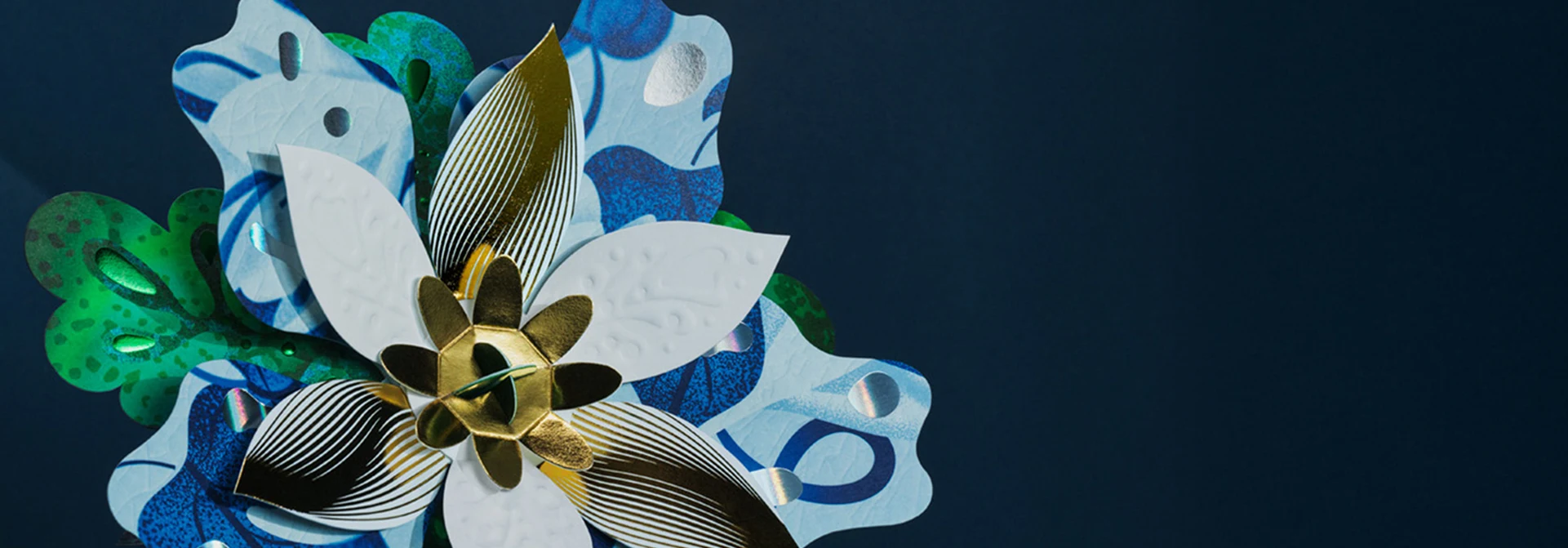 Paperboard flower against dark blue background
