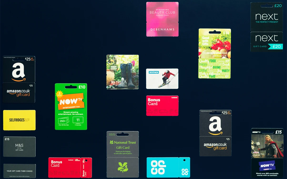 Different paperboard gift cards on dark background