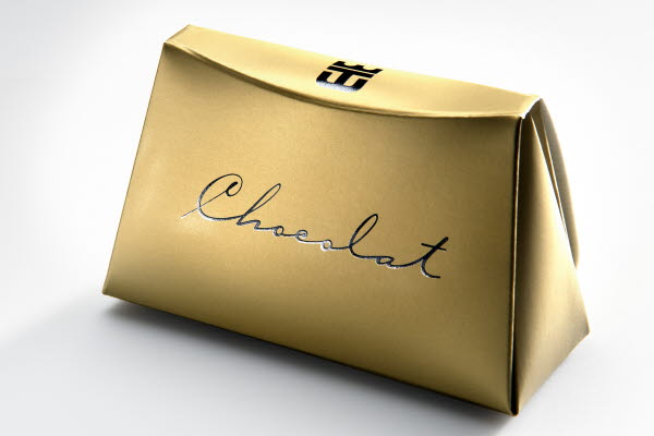 Gold purse shaped packaging for chocolate with metallised finish