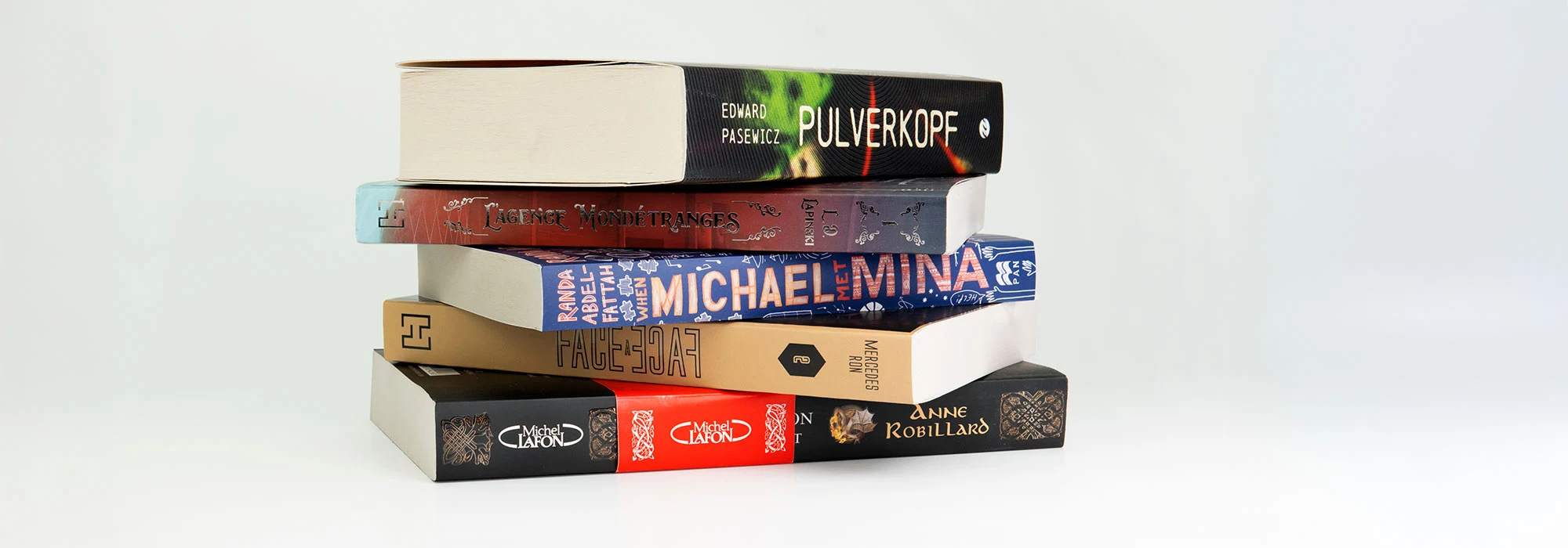 A pile of books on grey background