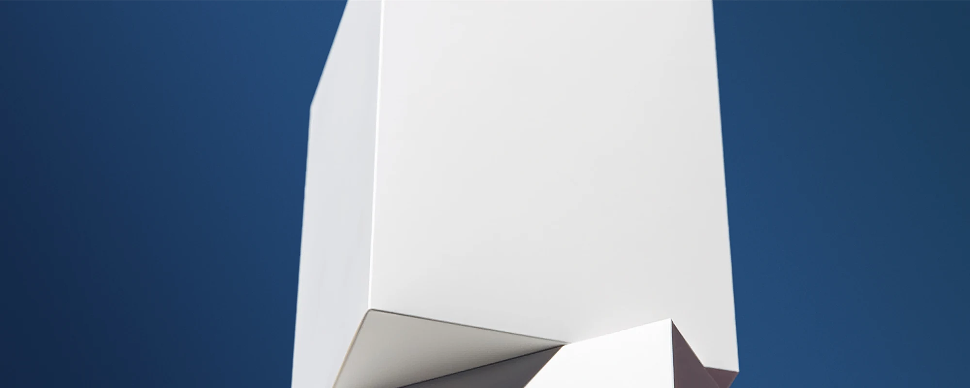 White paperboard boxes on blue background