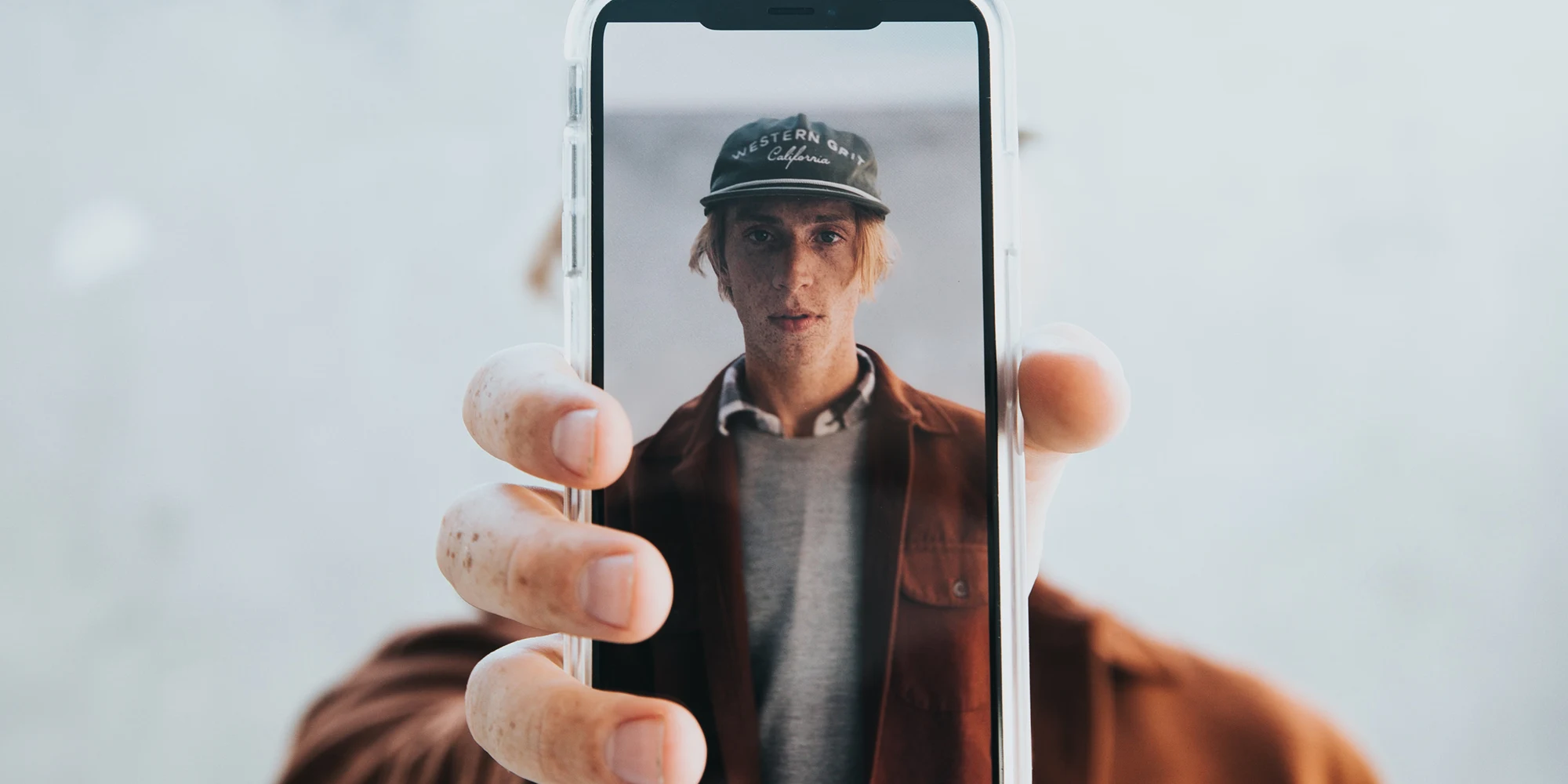 Influencer holding mobile phone
