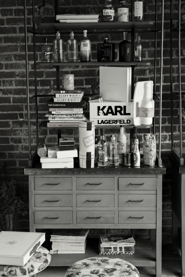 Bookcase with bottles, products, design books and packaging ideas in black and white
