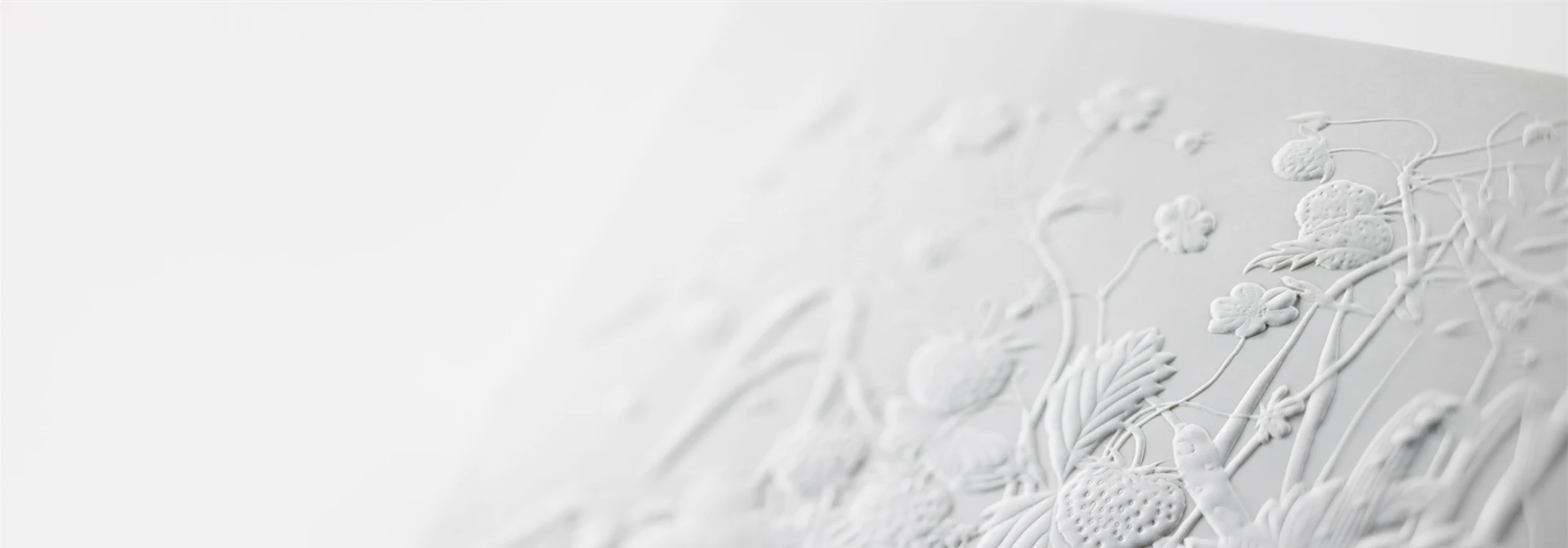 Blind embossed motif on a piece of paperboard