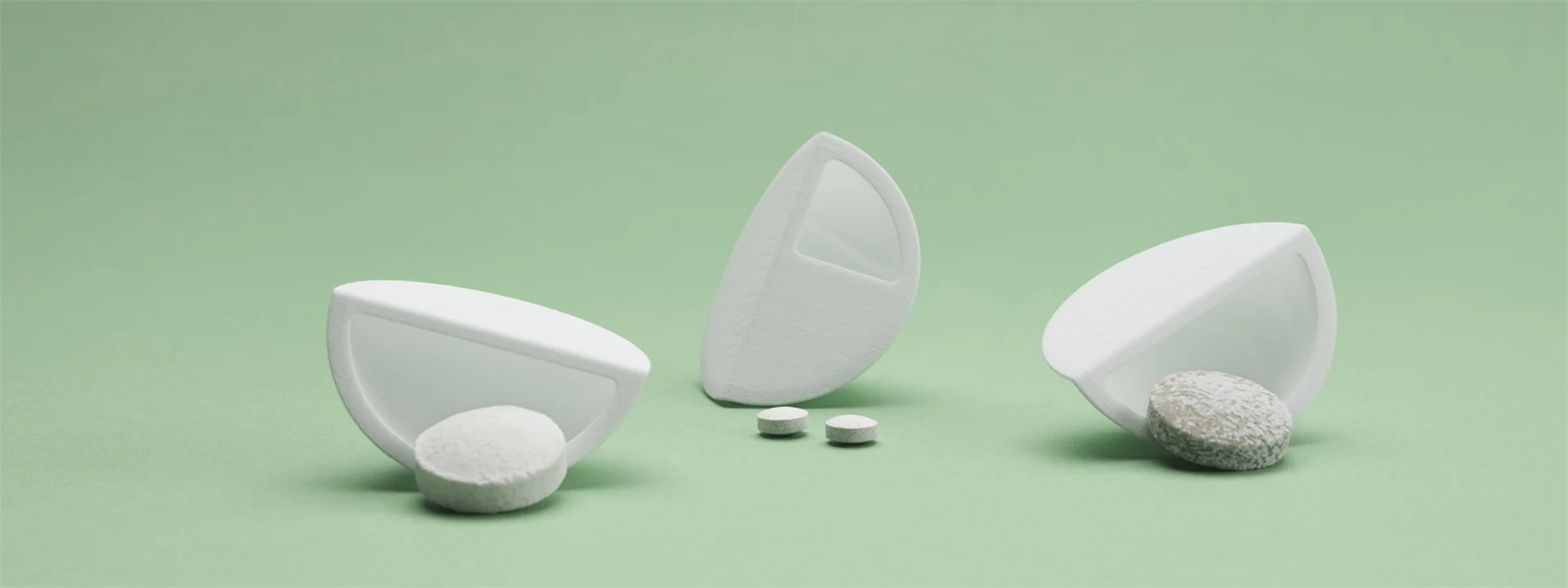 Wood-based travel kit with dissolvable tablets on green background